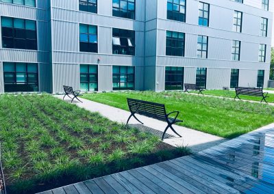 lanscaping with park benches and wooden walkway